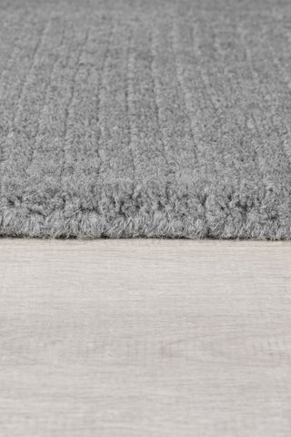 Alfombra con bordes de lana texturizada