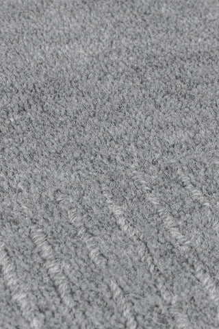Alfombra con bordes de lana texturizada