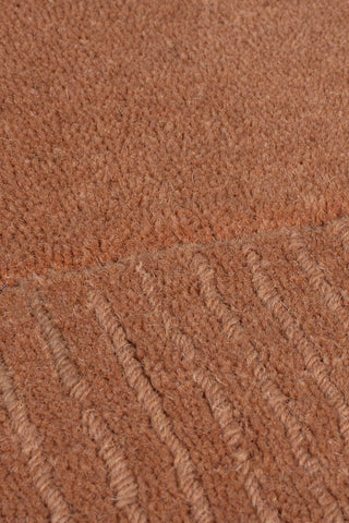 Alfombra con bordes de lana texturizada